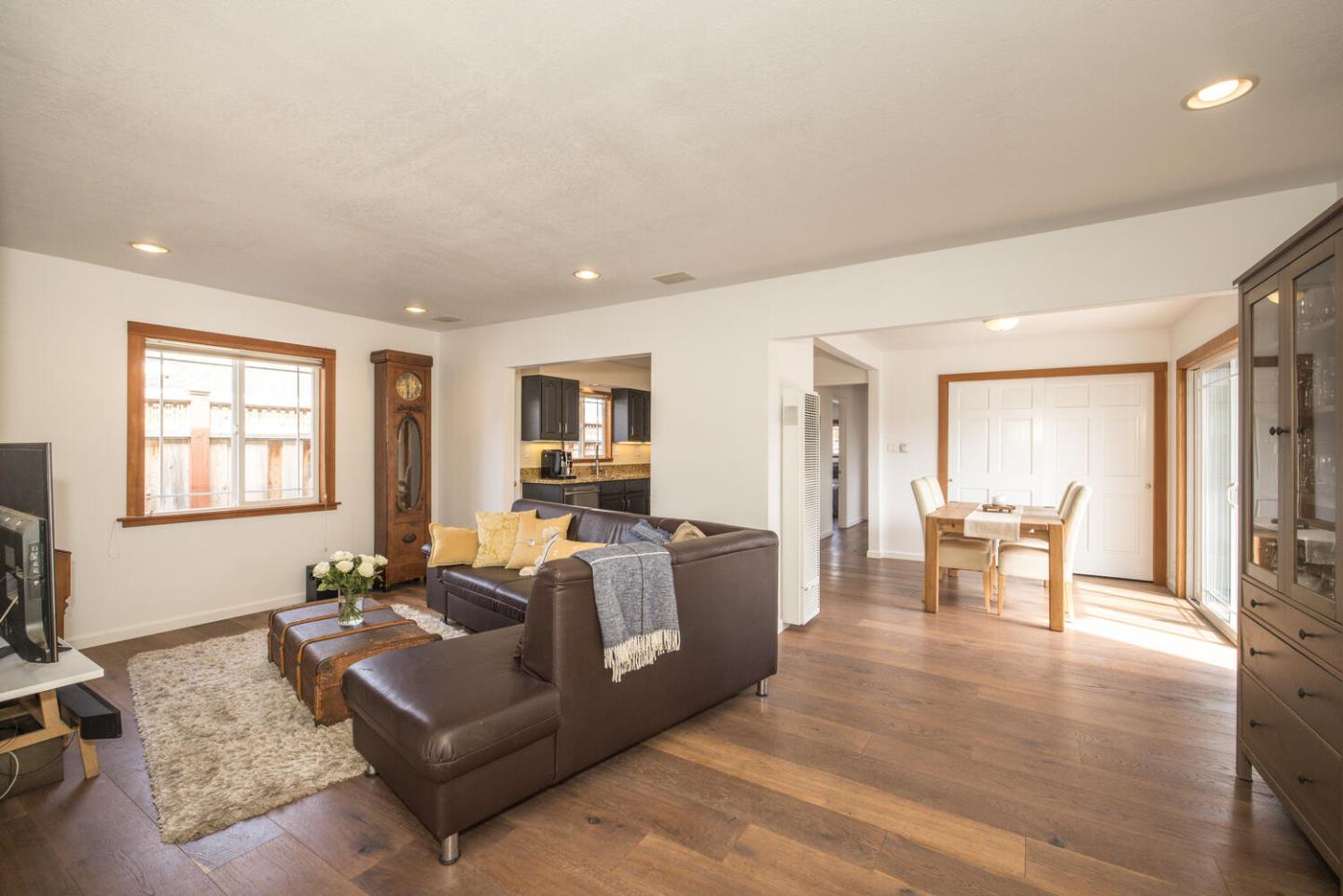 365 Spruce Street Half Moon Bay, CA 94019 - Photo 11 of 34 a living room with furniture and a flat screen tv
