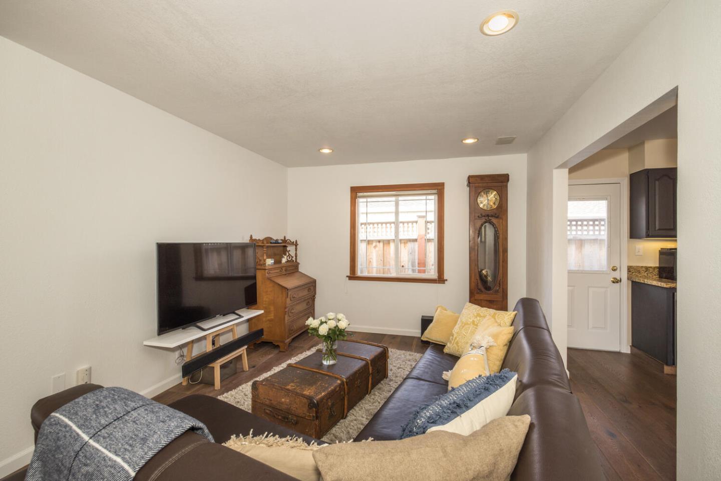 365 Spruce Street Half Moon Bay, CA 94019 - Photo 12 of 34 a living room with furniture and a flat screen tv