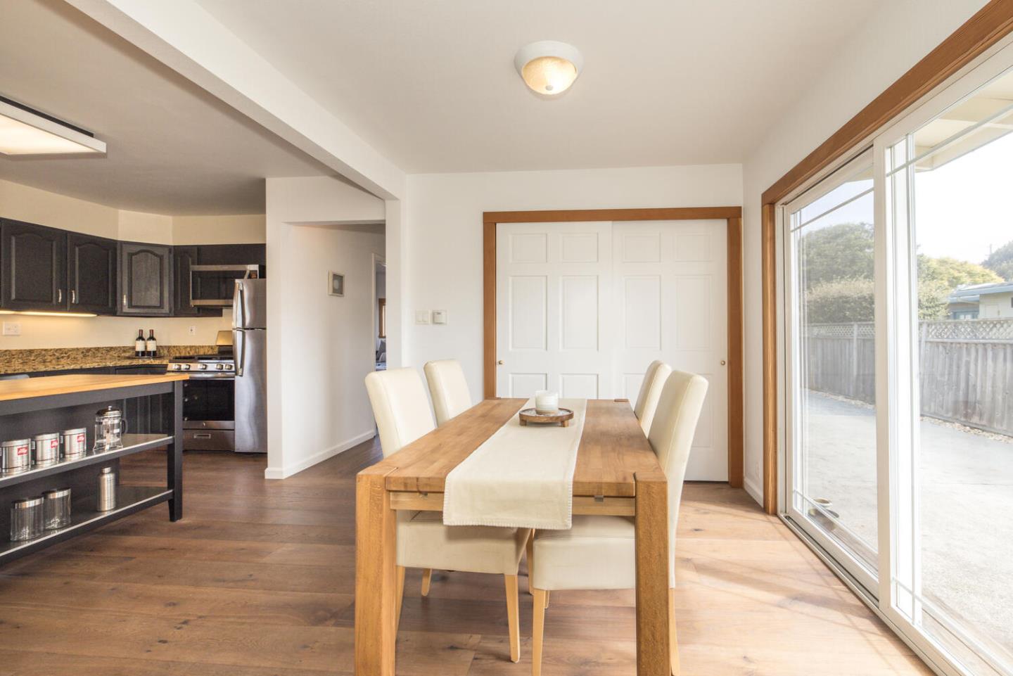 365 Spruce Street Half Moon Bay, CA 94019 - Photo 13 of 34 a view of a dining room with furniture and a kitchen view
