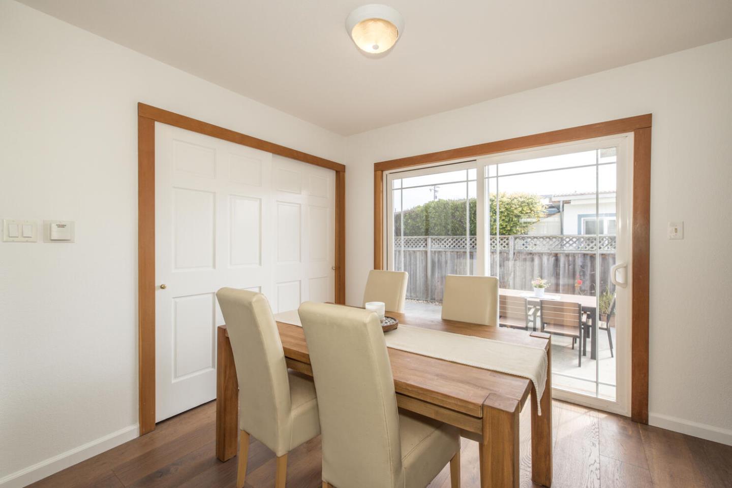 365 Spruce Street Half Moon Bay, CA 94019 - Photo 14 of 34 a view of a dining room with furniture window and wooden floor