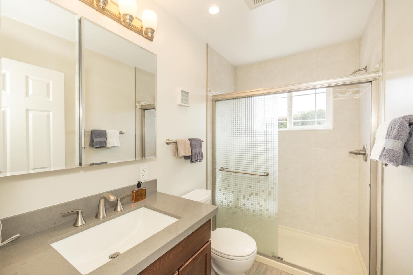 365 Spruce Street Half Moon Bay, CA 94019 - Photo 19 of 34 a bathroom with a sink a toilet and shower