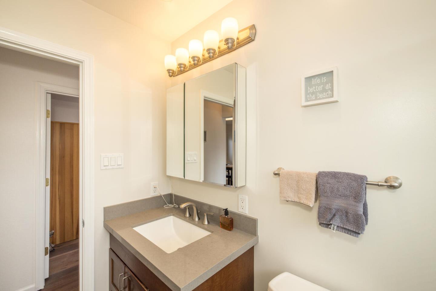 365 Spruce Street Half Moon Bay, CA 94019 - Photo 20 of 34 a bathroom with a sink and a mirror