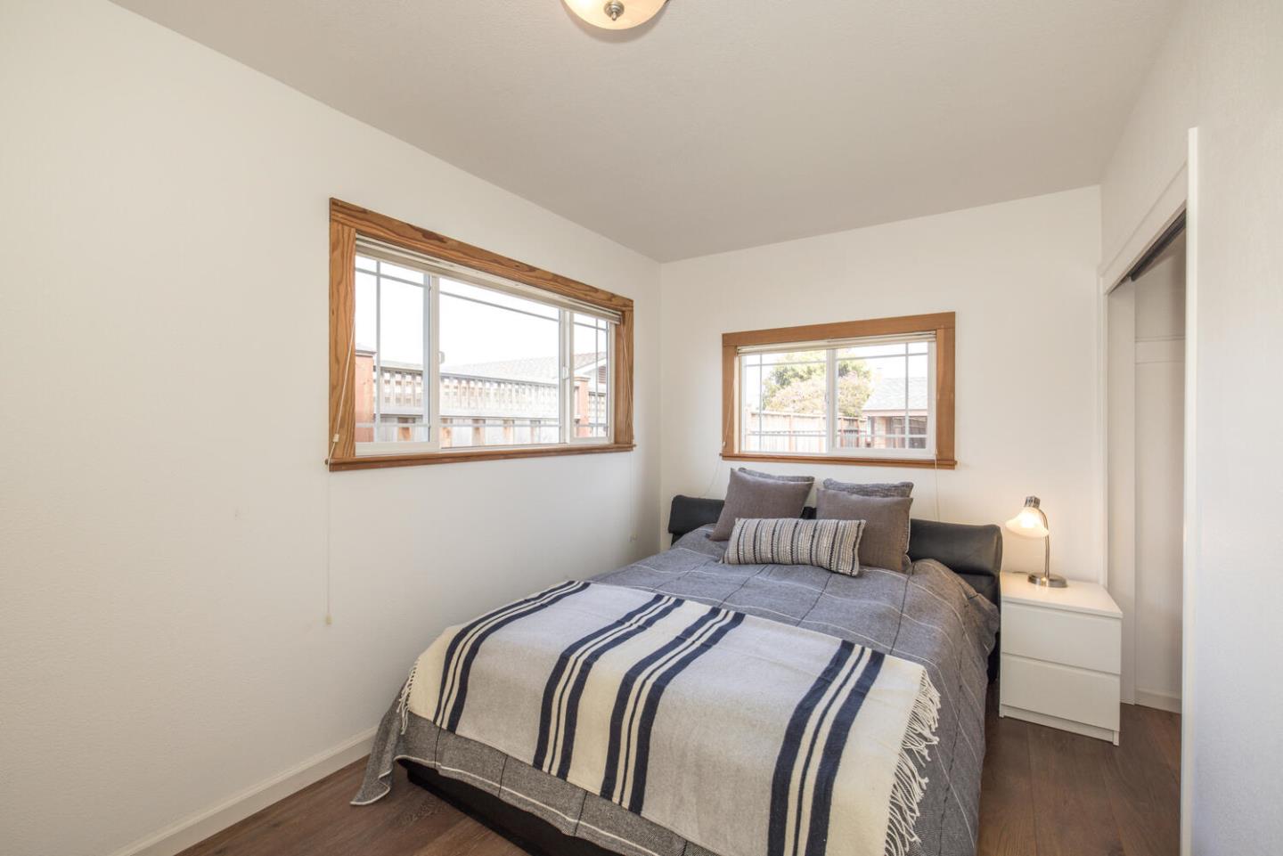 365 Spruce Street Half Moon Bay, CA 94019 - Photo 21 of 34 a bedroom with a bed and a window