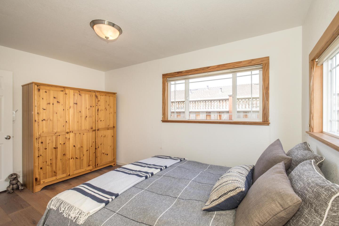 365 Spruce Street Half Moon Bay, CA 94019 - Photo 22 of 34 a bedroom with a bed and a window