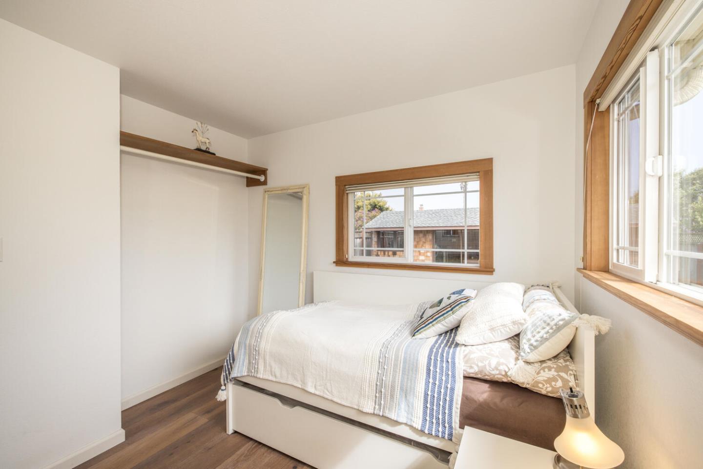 365 Spruce Street Half Moon Bay, CA 94019 - Photo 23 of 34 a bedroom with a bed and a window