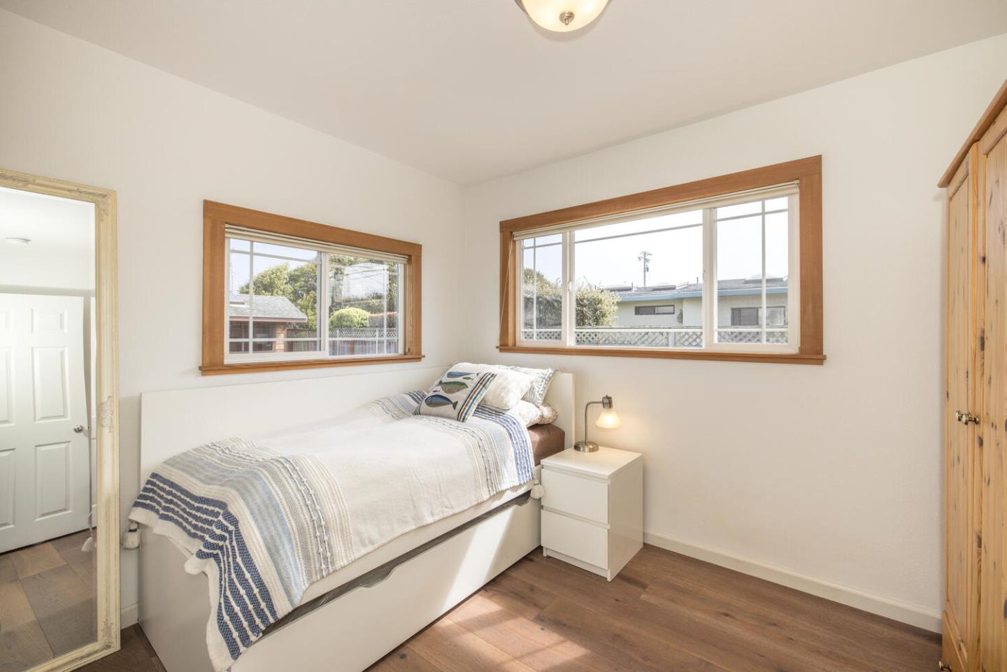 365 Spruce Street Half Moon Bay, CA 94019 - Photo 24 of 34 a bedroom with a bed and a window