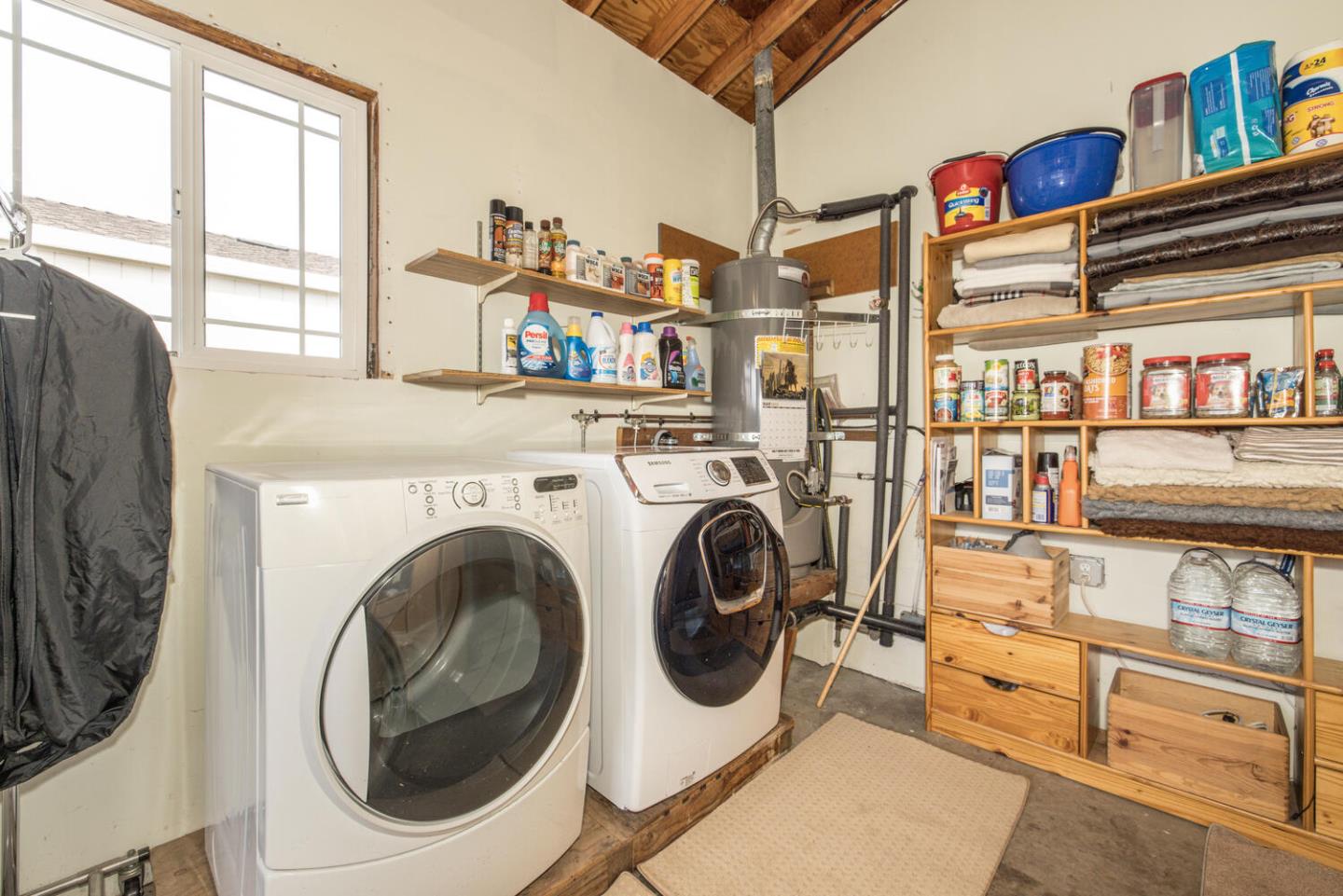 365 Spruce Street Half Moon Bay, CA 94019 - Photo 27 of 34 a view of a living room with washer and dryer