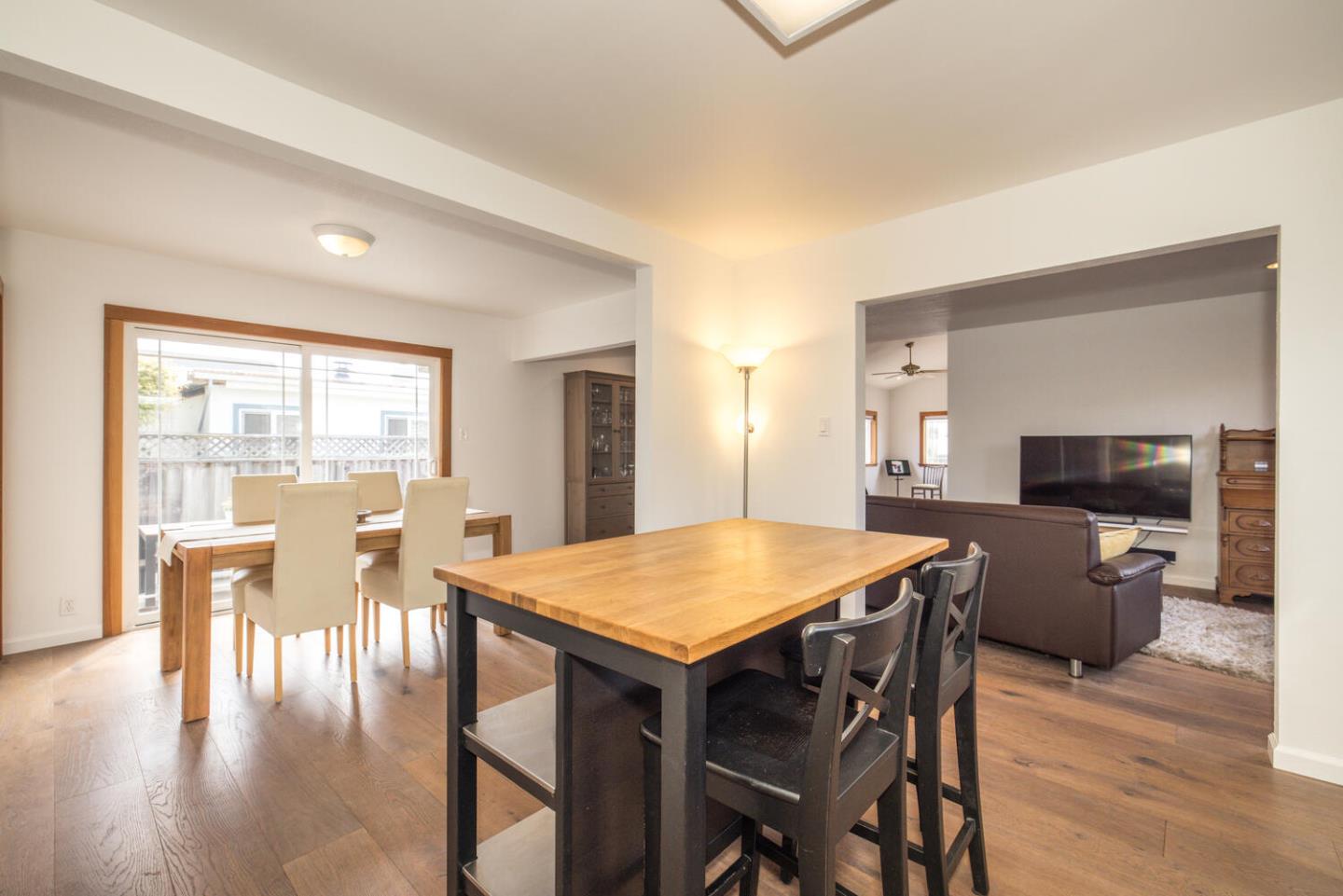 365 Spruce Street Half Moon Bay, CA 94019 - Photo 7 of 34 a view of a dining room with furniture window and wooden floor