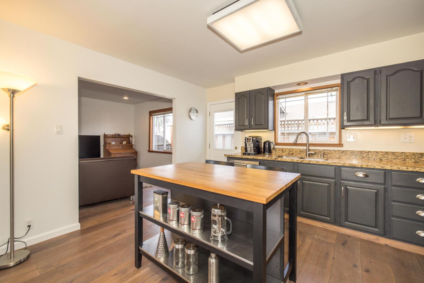 365 Spruce Street Half Moon Bay, CA 94019 - Photo 8 of 34 a kitchen with stainless steel appliances granite countertop a stove and a refrigerator