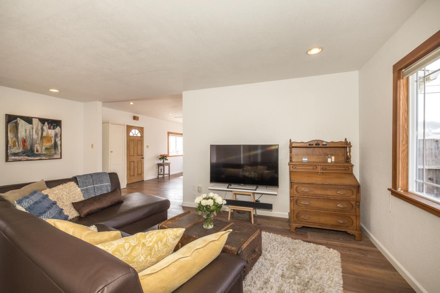 365 Spruce Street Half Moon Bay, CA 94019 - Photo 10 of 34 a living room with furniture and a flat screen tv