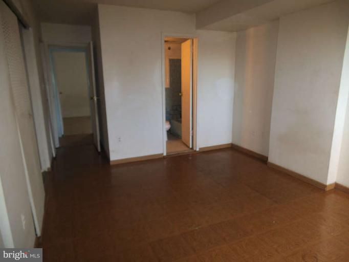 7953 Riggs Road, Unit 79532 Hyattsville, MD 20783 - Photo 8 of 10 an empty room with windows