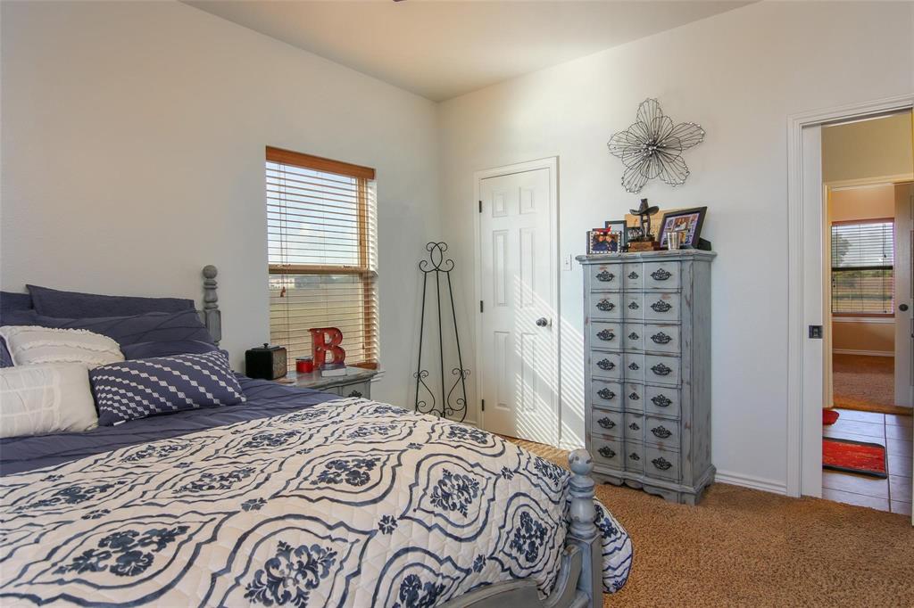 7158 Luella Road Sherman, TX 75090 - Photo 11 of 40 a bedroom with a bed and a window
