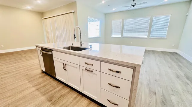 a bathroom with a bathtub and a window