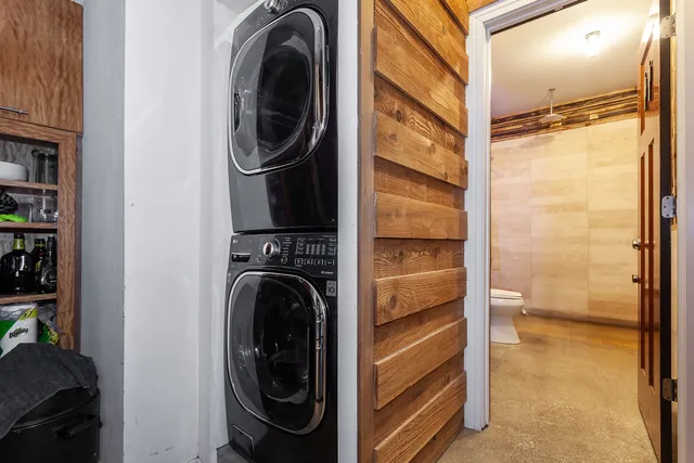 a utility room with sink dryer and washer