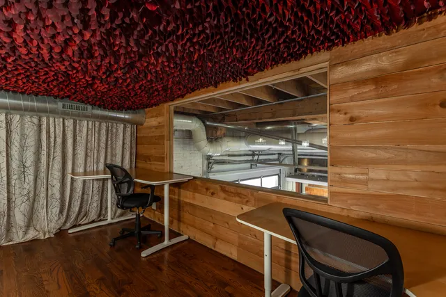 a room with wooden floor and furniture