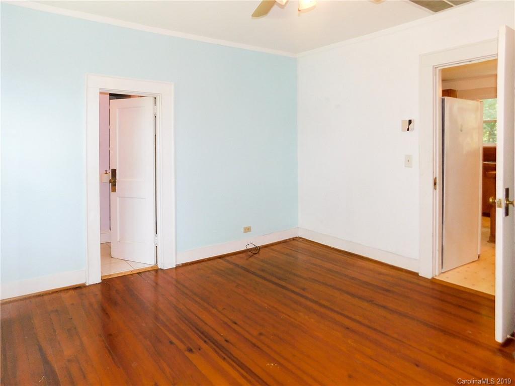 6201 Rumple Road Charlotte, NC 28262 - Photo 14 of 22 a view of empty room with wooden floor and closet