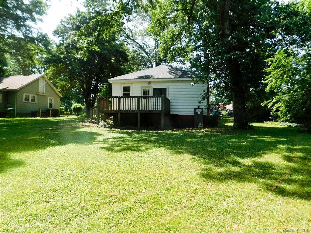 6201 Rumple Road Charlotte, NC 28262 - Photo 20 of 22 a front view of a house with a yard