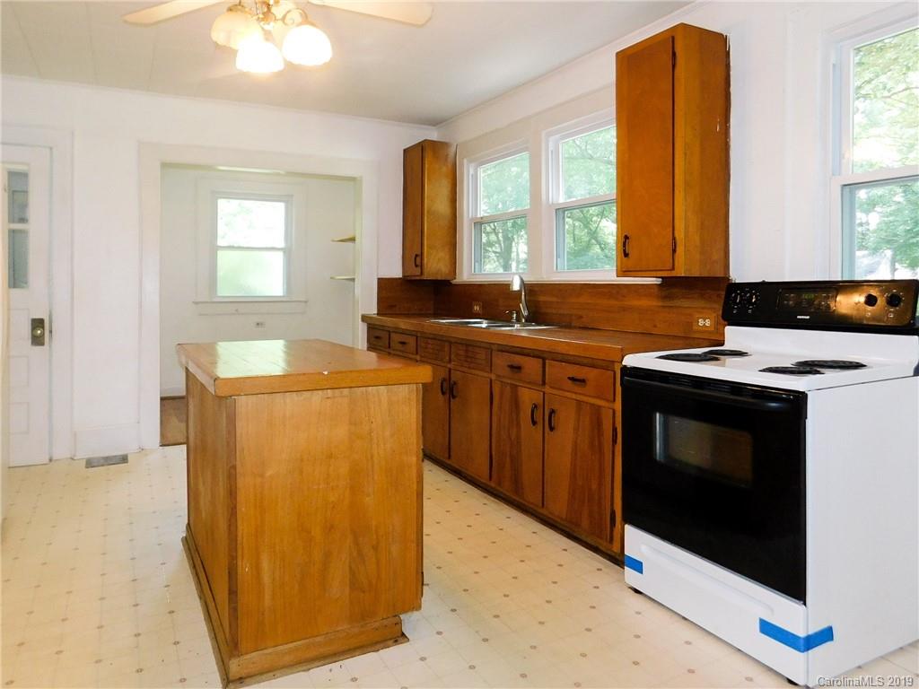 6201 Rumple Road Charlotte, NC 28262 - Photo 8 of 22 a kitchen that has a sink and a stove in it