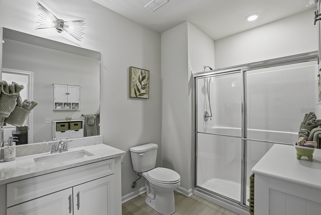 2 Codman Way, Unit 2203 Westborough, MA 01581 - Photo 12 of 36 a bathroom with a sink a toilet and shower