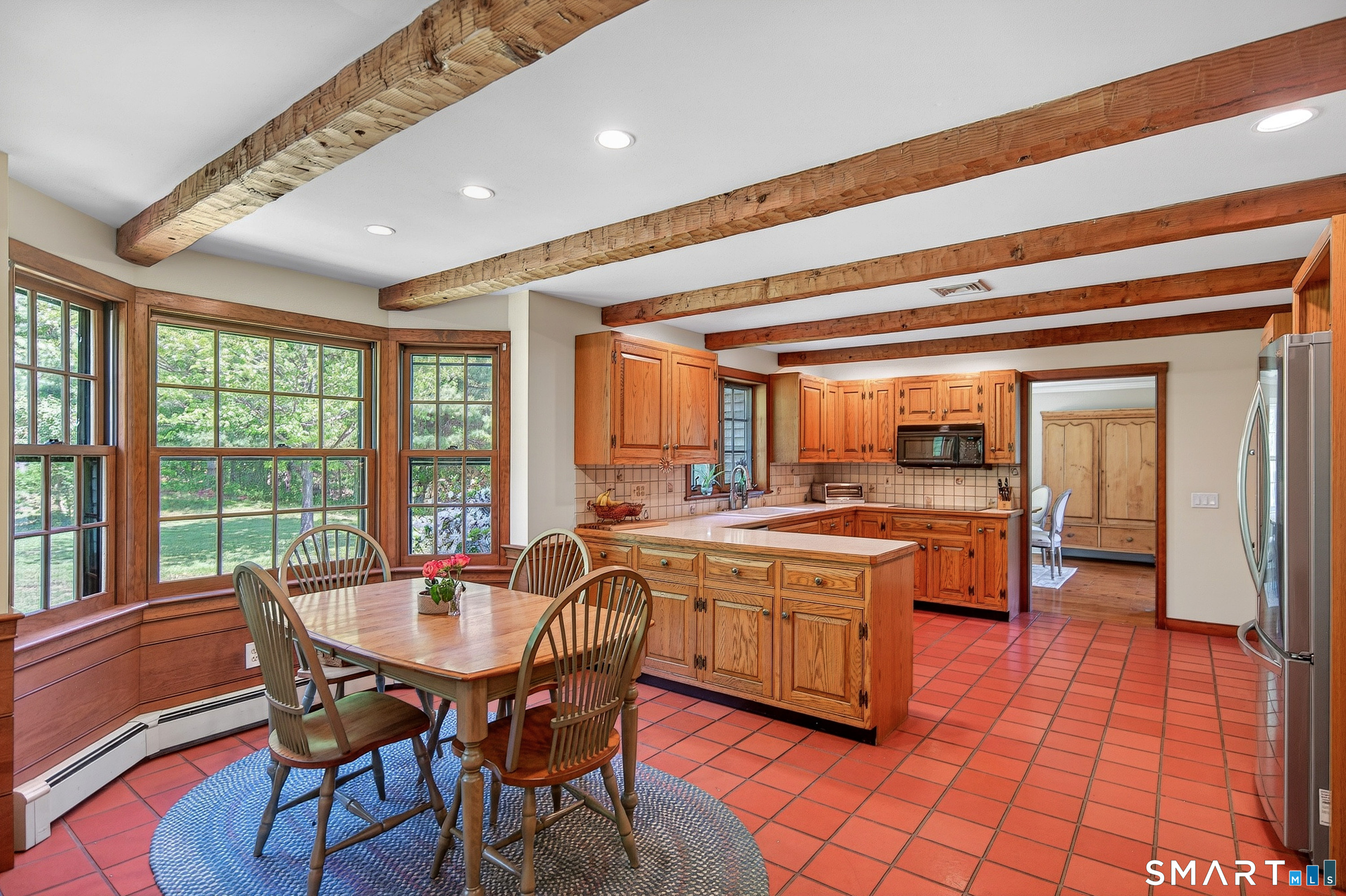 174 Huntingtown Road Newtown, CT 06470 - Photo 12 of 40 a kitchen with a sink and chairs