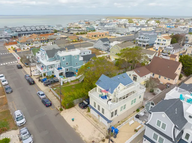 an aerial view of residential building with parking