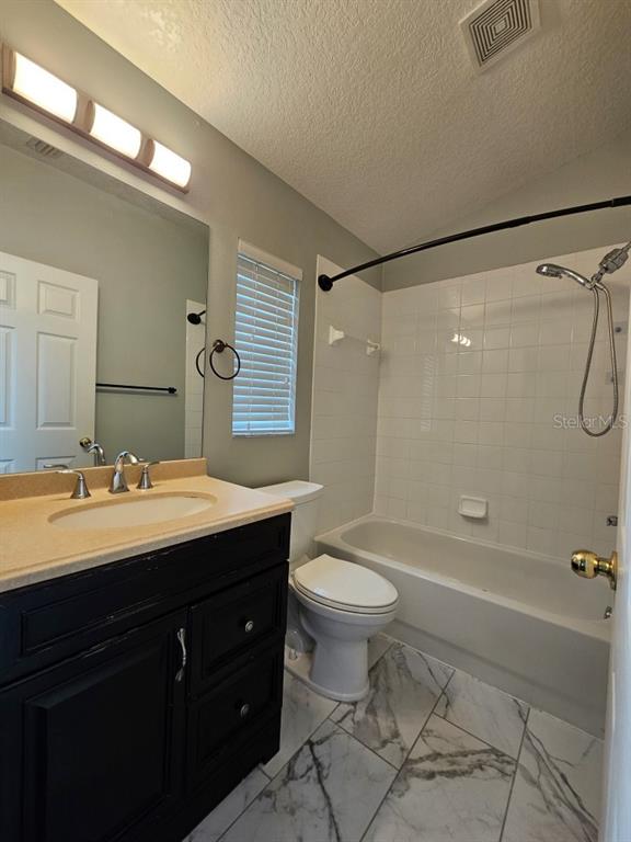 1404 Blue Magnolia Road Brandon, FL 33510 - Photo 11 of 21 a bathroom with a sink a toilet and shower