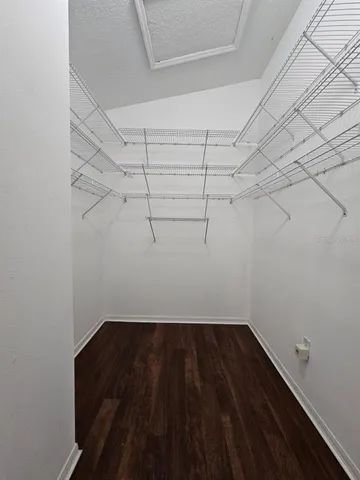 a view of a room with racks on the wall