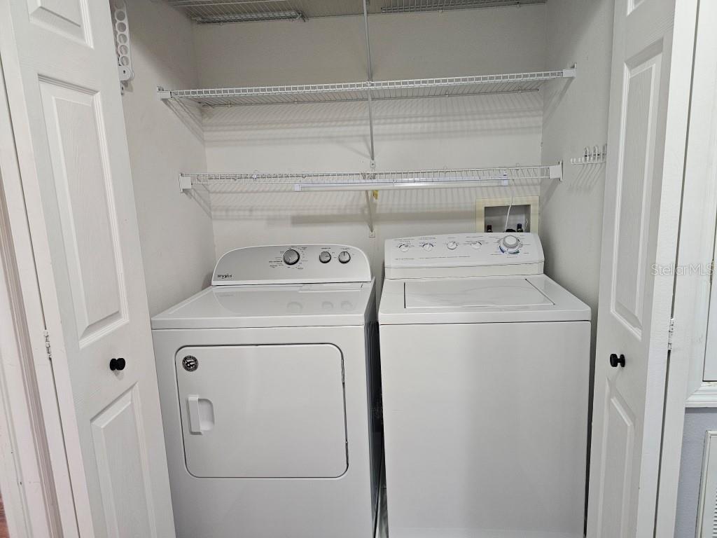 1404 Blue Magnolia Road Brandon, FL 33510 - Photo 13 of 21 a utility room with dryer and washer