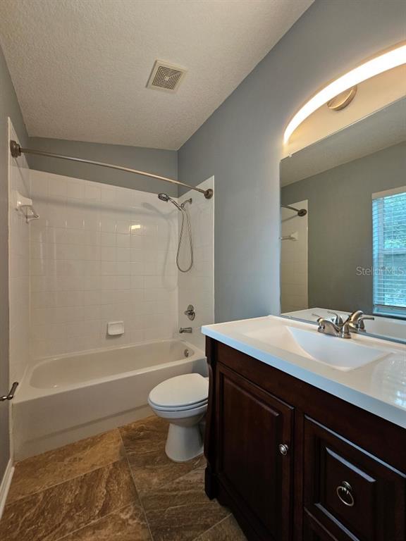 1404 Blue Magnolia Road Brandon, FL 33510 - Photo 16 of 21 a bathroom with a sink toilet a mirror and shower