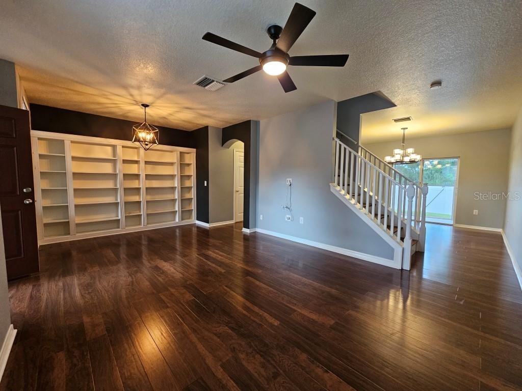1404 Blue Magnolia Road Brandon, FL 33510 - Photo 3 of 21 a view of a livingroom with wooden floor