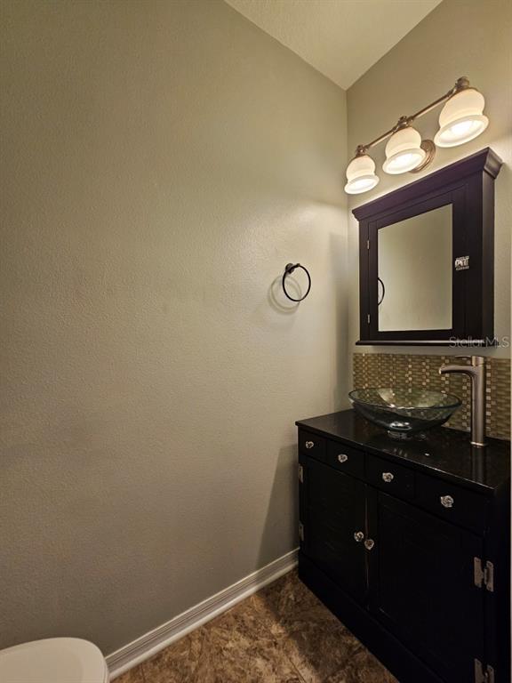 1404 Blue Magnolia Road Brandon, FL 33510 - Photo 5 of 21 a bathroom with a sink and a mirror