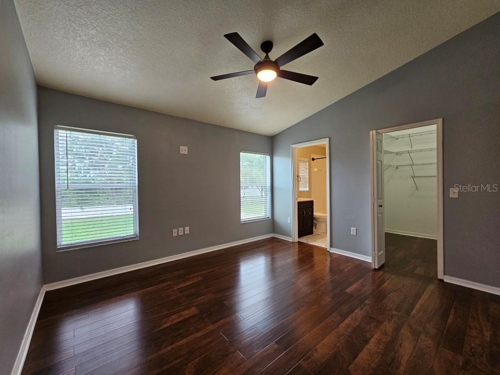 1404 Blue Magnolia Road Brandon, FL 33510 - Photo 9 of 21 a view of an empty room with wooden floor and a window