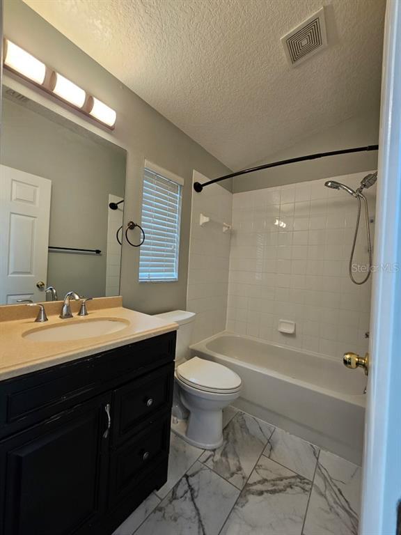 1404 Blue Magnolia Road Brandon, FL 33510 - Photo 10 of 21 a bathroom with a double vanity sink toilet mirror and shower