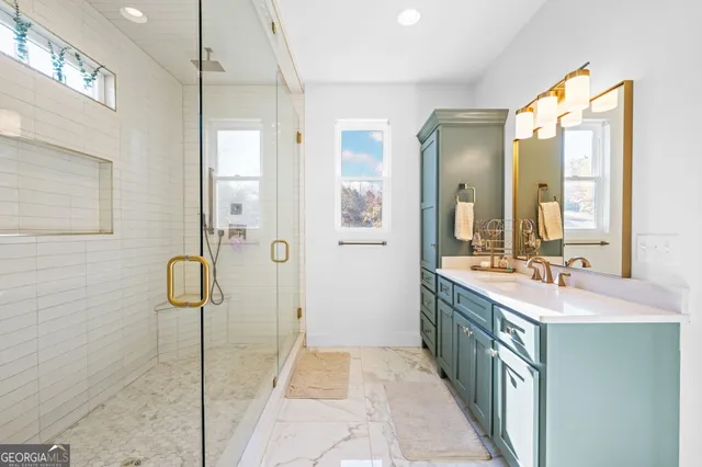 a view of a dry yard with large trees