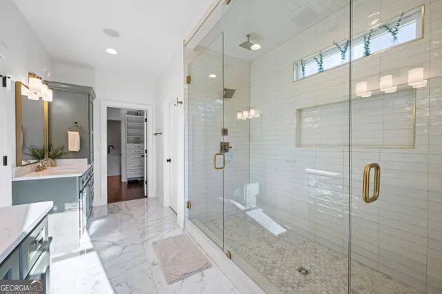 a view of a lake with a yard and large trees