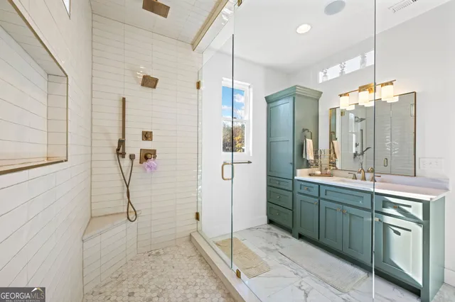 a view of a house with a yard and potted plants