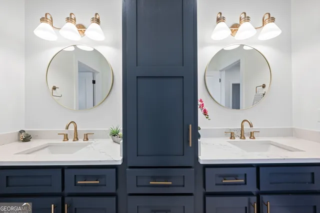 a kitchen with stainless steel appliances a stove a sink dishwasher a refrigerator and a microwave oven with wooden floor