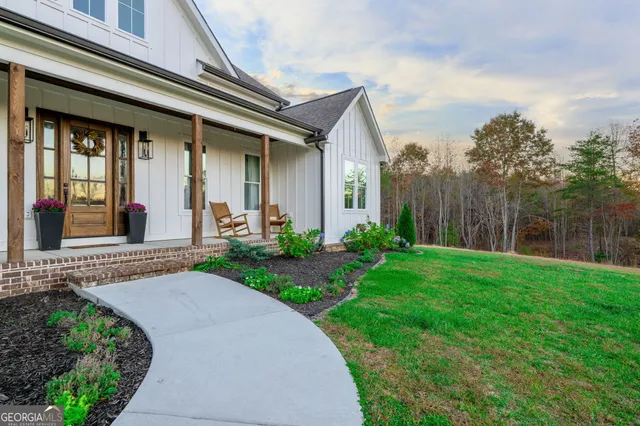 a bathroom with a bathtub shower sink vanity and toilet