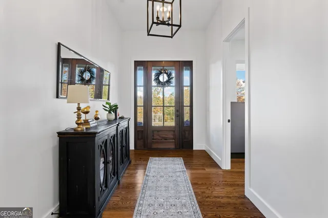 a bedroom with a bed a desk and chair