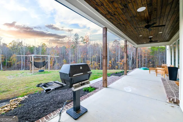 a dining table sitting next to a window