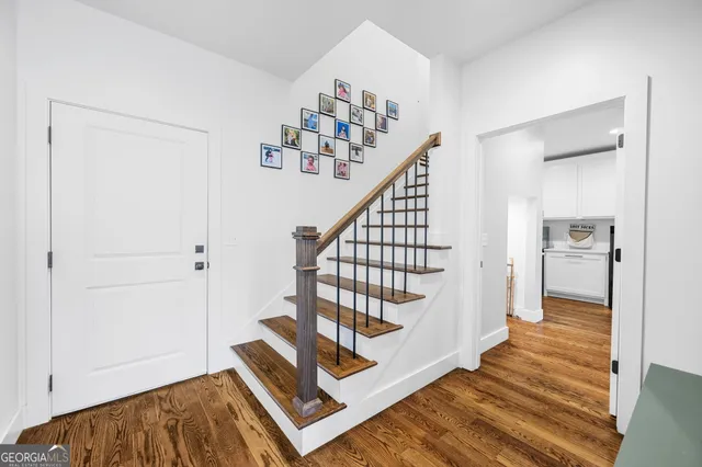 a large kitchen with a sink and large window