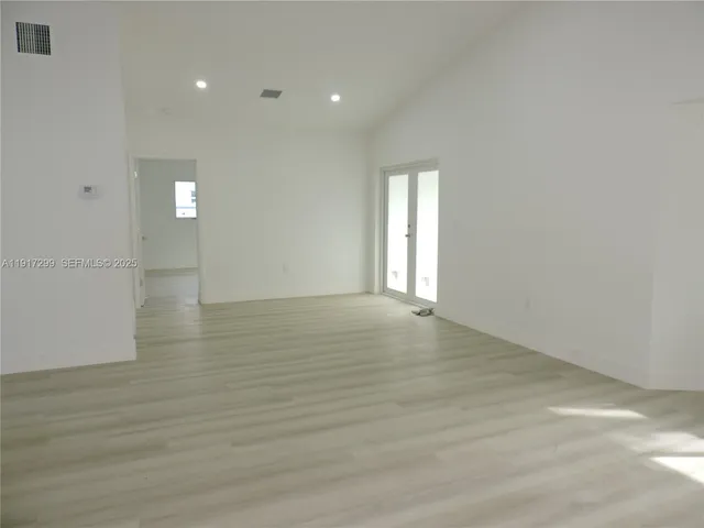 a kitchen with a refrigerator sink and stove