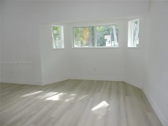 a kitchen with stainless steel appliances a refrigerator sink and microwave