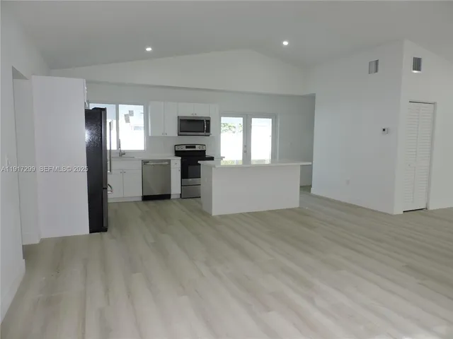 a view of a bathroom with toilet sink and vanity