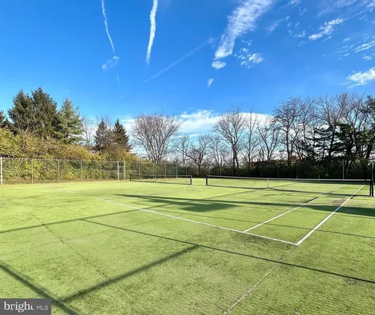a view of an outdoor space and tennis court
