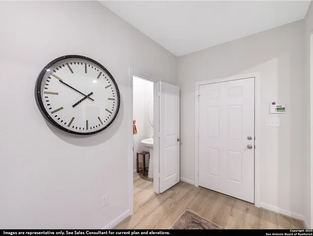 a view of a hallway with a wall clock