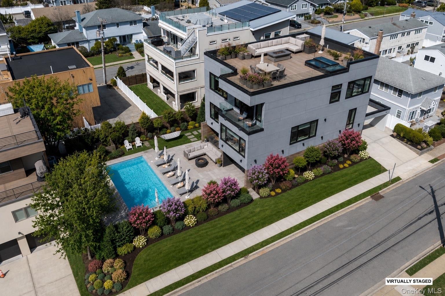 46 Nantwick Street Lido Beach, NY 11561 - Photo 4 of 47 **Virtually Staged Foliage & Rooftop Deck**