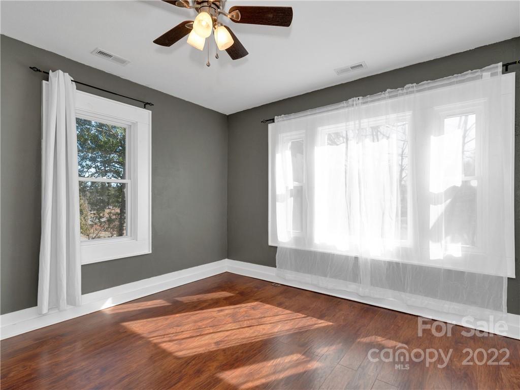 1739 Old Clyde Road Clyde, NC 28721 - Photo 18 of 24 a view of an empty room with wooden floor and a window