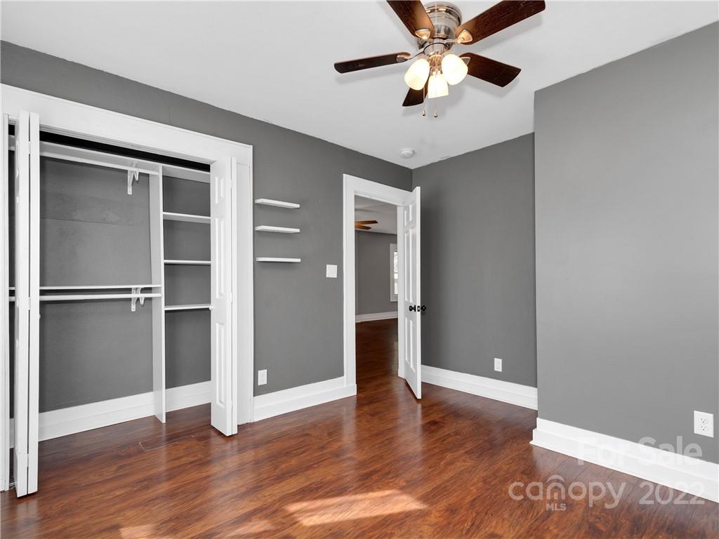 1739 Old Clyde Road Clyde, NC 28721 - Photo 19 of 24 a view of an empty room with window and wooden floor