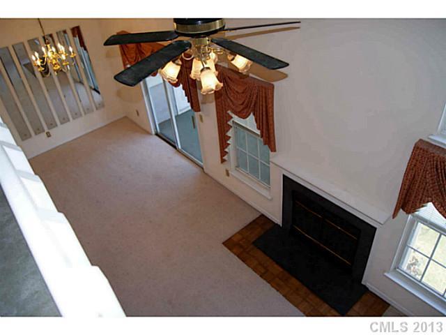 19823 Henderson Road, Unit E Cornelius, NC 28031 - Photo 2 of 14 a view of entryway and hall with wooden floor